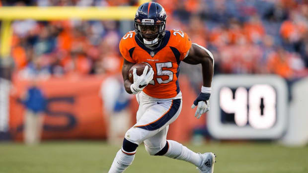 Dec 12, 2021; Denver, Colorado, USA; Denver Broncos running back Melvin Gordon III (25) runs the ball in the third quarter against the Detroit Lions at Empower Field at Mile High.